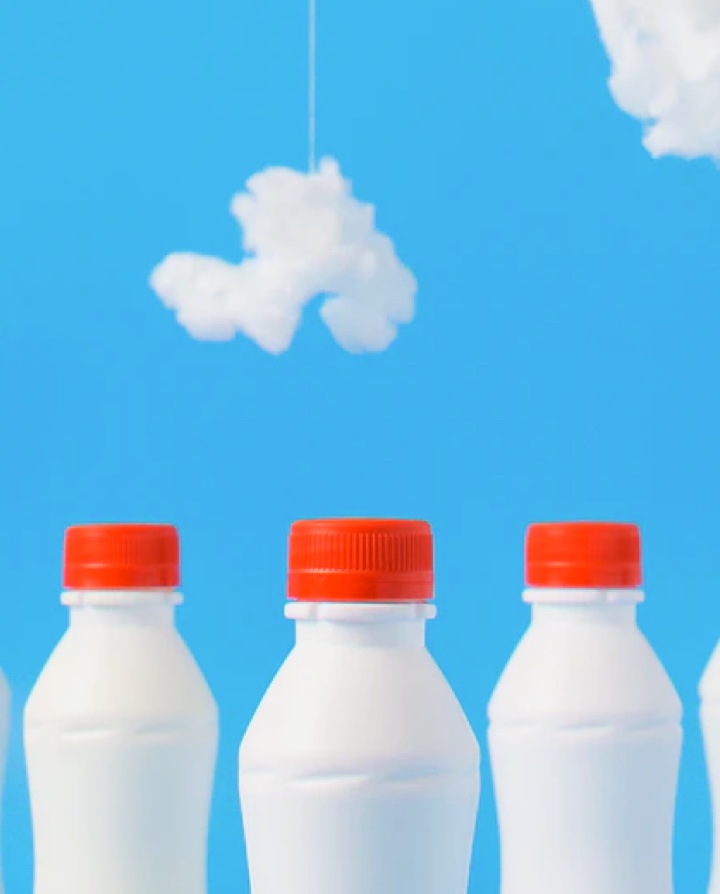 Image of some milkbottles with clouds