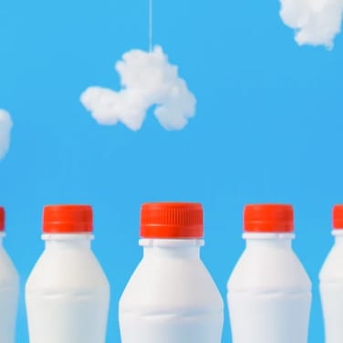 Image of some milkbottles with clouds